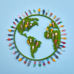World Population Day, creative concept. Large and diverse group of people in the shape of the world map